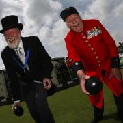 Knights of the green and the Chelsea Pensioners bowling at Southamptom Old Bowling Green , the world oldest bowling green - Master of the Green Sir John Pheasant and Chelsea Pensioners captain Tom Beardsley share a joke before the game