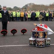 Trainee Engineering Technician Marine Engineering William Lamont lays a wreath.