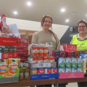 Lion Ruth Blake presented the recent food donation to Eve Ibbott from the Romsey Foodbank