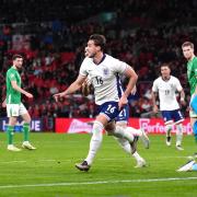 Taylor Harwood-Bellis (centre) celebrates scoring on his England debut