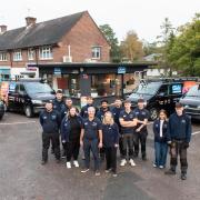 Staff from Gair Homes standing in front of Gair Gas vans