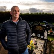 Michael McConville, son of IRA murder victim Jean McConville, at his parents’ grave in Lisburn (Liam McBurney/PA)