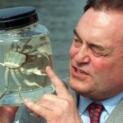 Deputy Prime Minister John Prescott takes a close look at a Chinese Mitten Crab called Dennis (Ben Curtis/PA)