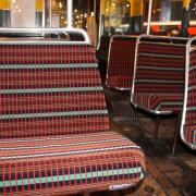 Seats on the museum’s iconic red AEC Regent III RT bus