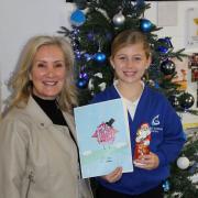 Caroline Dinenage MP and competition winner Emelia