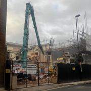 The demolition of the old Firehouse pub on Vincent's Walk is underway.