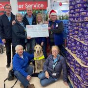 Colleagues at the Tesco Superstore in Whiteley with members of the local Guide Dogs group