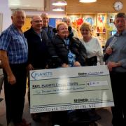 The charity receiving its cheque