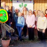 Members of Waterside Scrapstore donated a life-saving defibrillator to Ian and Louise Nelson, owners of Sunnyfields Farm at Totton