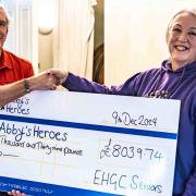 East Horton senior's captain, Peter Newman (left) presenting a cheque to CEO of Abby’s Heroes, Sally Randall (right)