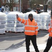 Long queues as people collect bottles of water at Places Leisure in Eastleigh.