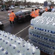 Long queues as people collect bottles of water at Places Leisure in Eastleigh.