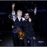 Sir Paul McCartney welcomed his former Beatles bandmate Sir Ringo Starr to the stage on Thursday night (MPL Communications/MJ Kim/PA)