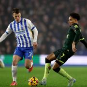 Solly March (left) and Kevin Schade battle for the ball (PA)