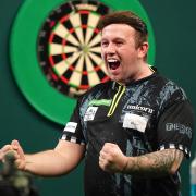 Callan Rydz, who has yet to drop a set at the World Championship, celebrates his win over Dimitri Van den Bergh (Zac Goodwin/PA)