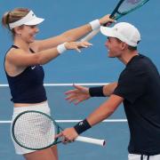 Katie Boulter and Charles Broom celebrate their crucial mixed doubles victory (Mark Baker/AP)