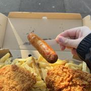 One of the 850-plus sausages sold each week at Sonny's Traditional Fish and Chips on Sandy Lane.