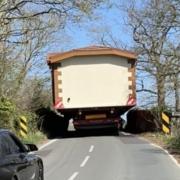 Mobile home stuck on railway bridge on Allington Lane