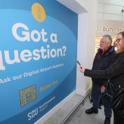 Travellers lining up to use the new AI assistant at Southampton Airport.