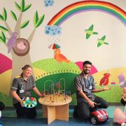 Hospital staff brighten children’s waiting room with hand-painted mural