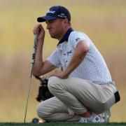 Justin Thomas lines up a putt on the 17th green during the second round of the RBC Heritage golf tournament (Mike Stewart/AP)