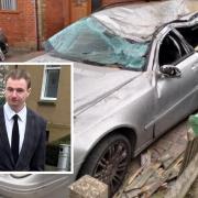 The driver and one of the cars that was wrecked in the crash