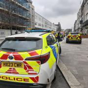 Police cordon in city centre near pub - live updates