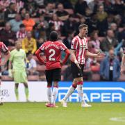 Southampton's Taylor Harwood-Bellis (left), Kyle Walker-Peters, Jan Bednarek, and Flynn Downes look dejected after Fulham's Ryan Sessegnon (not pictured) scores their side's second goal of the game during the Premier League match at St Mary's Stadium.