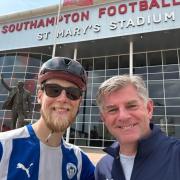 Matt Jopson, left, celebrating reaching St Mary's Stadium with a holidaymaker, right.