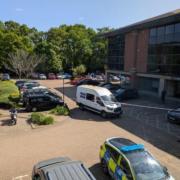 A woman has suffered life-threatening injuries in a stabbing at an office block