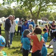 Leaders watch Scouts enjoying activities