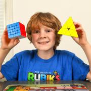 Pictured Jacob Moletti practices with his favourite cubes that he competes with, at his home in Southampton, Hants.