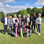 Pilates instructor Andrea Hill (5th from the left), who is hosting a Charity Day in aid of Communicare