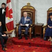 The Queen (second right) and Canadian Prime Minister Mark Carney (front left) listen to Charles (centre) during his speech (Aaron Chown/PA)