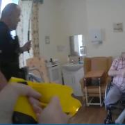 Handout screengrab from body worn video of the incident when Donald Burgess was sprayed in the face with synthetic pepper spray before being shot by a Taser and hit with a baton (IOPC/PA)