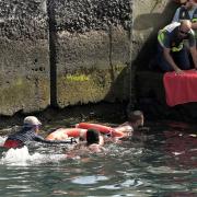 Survivors of a capsized boat are rescued in the port of El Hierro (Europa Press via AP)