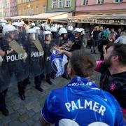 Riot police confront fans ahead of the Europa Conference League final (AP Photo/ Czarek Sokolowski)