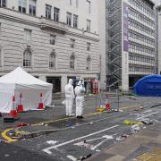 Forensic officers have been working at the scene in Water Street near the Liver Building in Liverpool (Peter Byrne/PA)