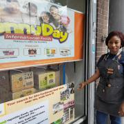 Nnenna Okonkwo , owner of Sunnyday International Foods, days after the front window was smashed