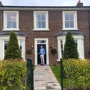 One of teh first homes built by Thakeham at Welborne. Tristan Robinson from the company on the doorstep.