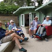 Enjoying a picnic in the garden at Colten Care’s The Aldbury in Poole.