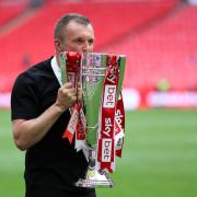 Charlton Athletic manager Nathan Jones with the League One play-off trophy after winning at Wembley