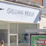 Plans to turn the upper floors of a commercial building into a flat have been withdrawn.