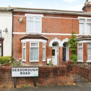 Terraced property with gated front garden and an allocated off-street parking space