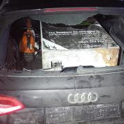 Officers from Hampshire, Dorset and Wiltshire police forces had to team up to arrest the driver of a stolen Audi, which had a stolen ATM in the back.