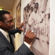 2013: Opening of new Hampshire Cricket Community Trust Study Centre at the Utilita Bowl called The Orbit -  West Indies batsman Gordon Greenidge signs his photograph that is on display