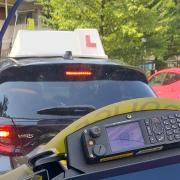 A driving instructor was caught using a mobile phone behind the wheel by police in Southampton