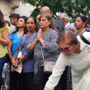 People attend a candlelight vigil outside the High Commission of India (James Manning/PA)