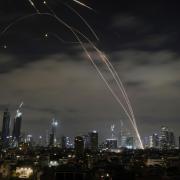 The Israeli Iron Dome air defence system fires to intercept missiles during an Iranian attack over Tel Aviv (Leo Correa/AP)