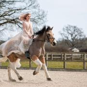 A bride riding her horse at her Langford Farm wedding